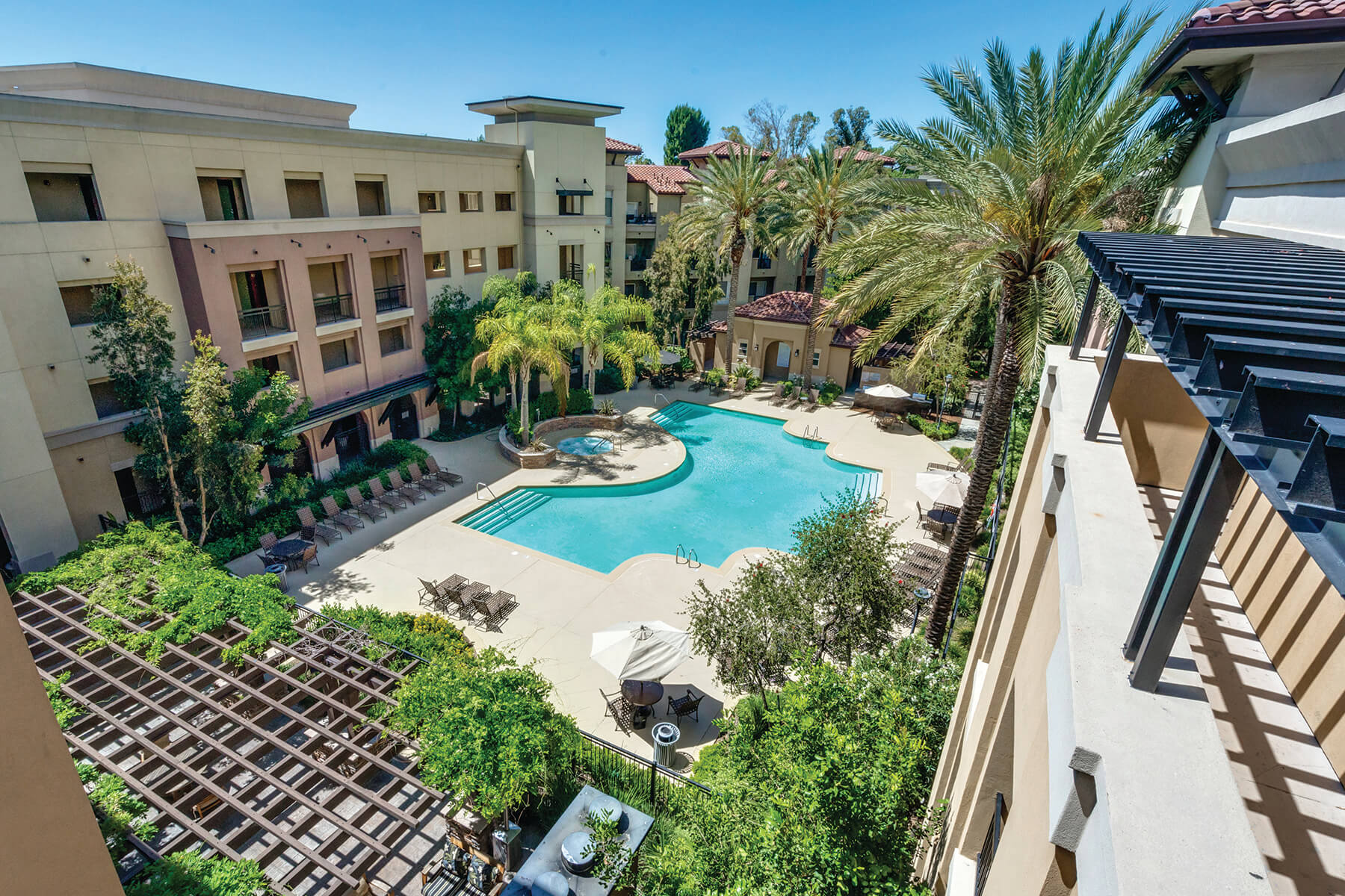 Aerial view of the courtyard pool at The Madison at Town Center apartments in Santa Clarita, California.